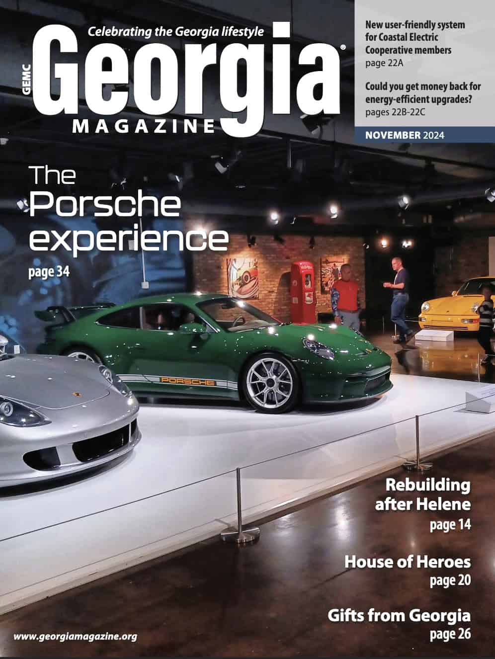 Georgia Magazine cover featuring the Porsche Experience with several cars on display and two people in the background.