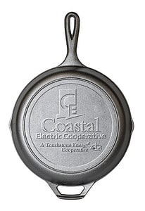 Lodge brand cast iron skillet embossed with the Coastal Electric Cooperative logo