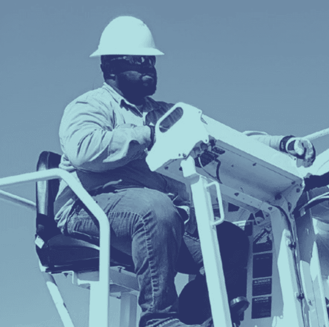 A lineman works on heavy equipment