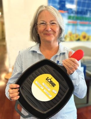 Laura McGee shows off a Lodge Cast Iron pan