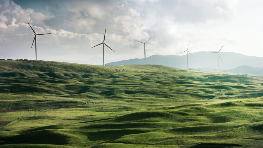 Giant wind turbines generate energy on a huge piece of land