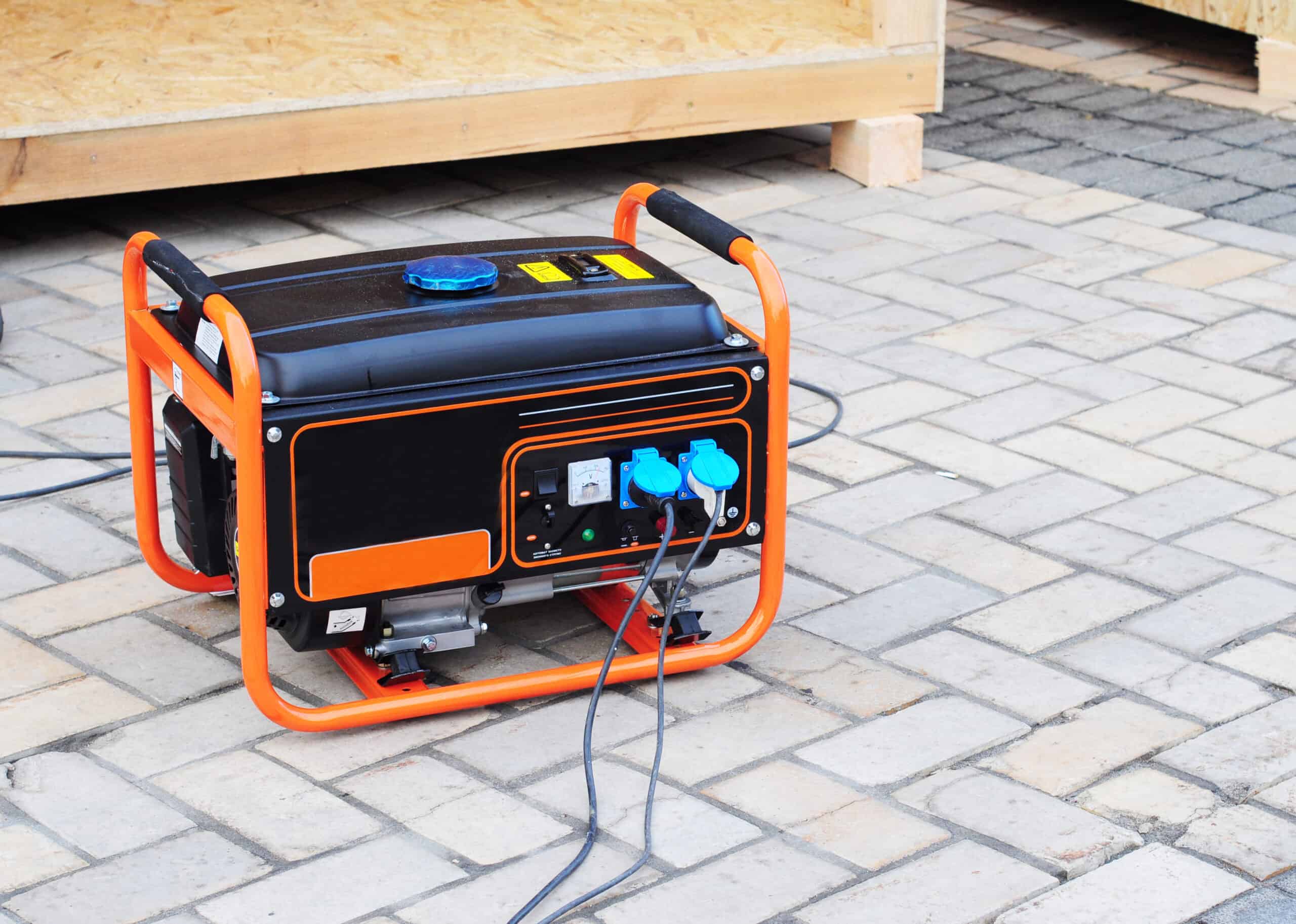 A portable generator runs outdoors.