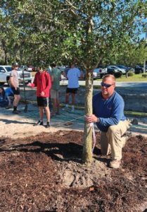 Coastal Electric Line Supervisor Clint Durrence helps space live oak trees