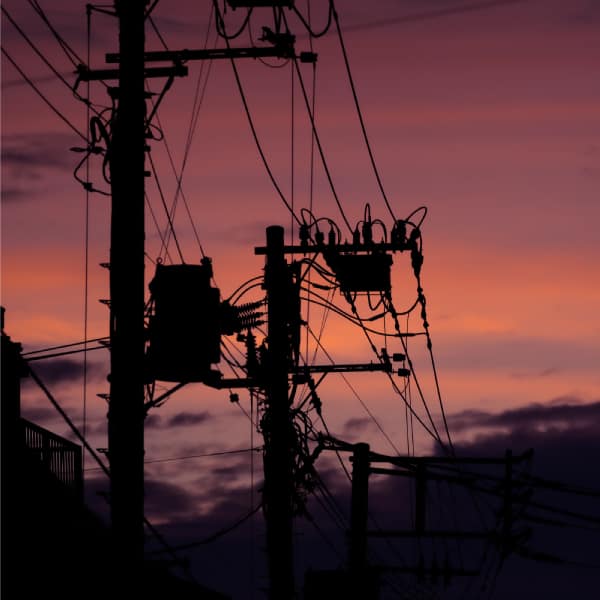 Power lines are seen at sunset