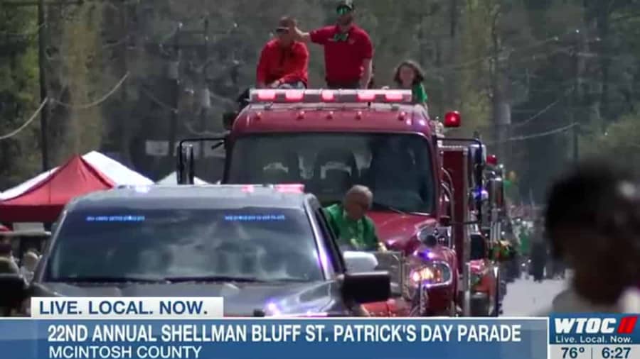 Firemen wave to the crowd at the Shellman Bluff Saint Patrick's Day parade